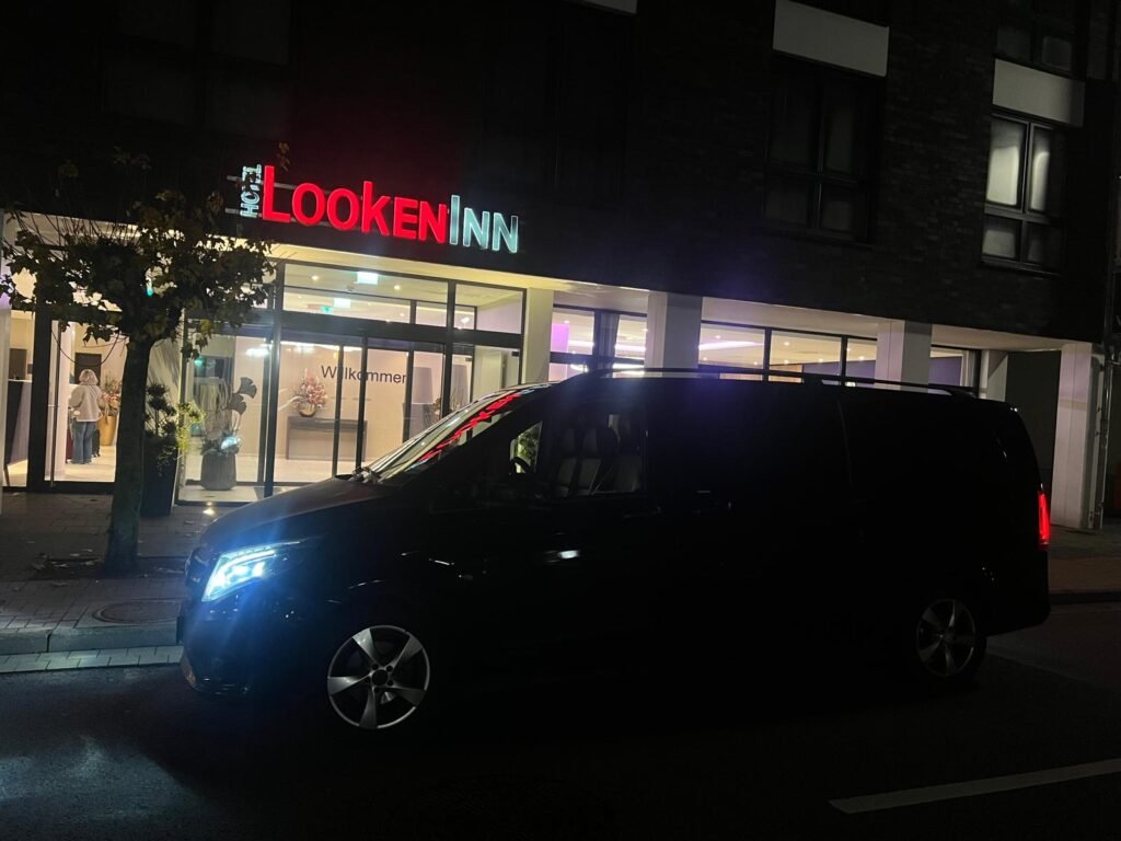 Black Mercedes van parked outside hotel